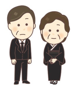 喪服姿の男性と女性