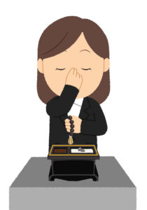 焼香をしている女性